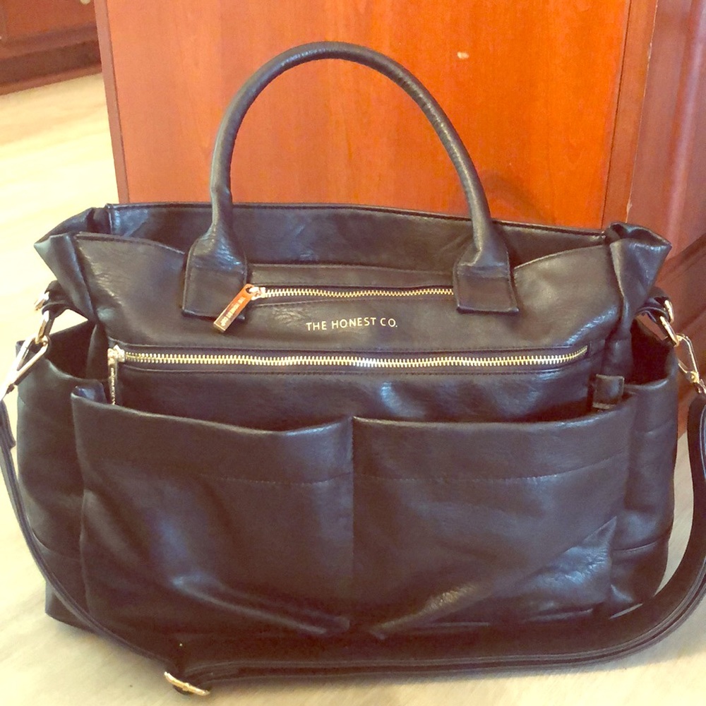 The Honest Co diaper bag with changing mat